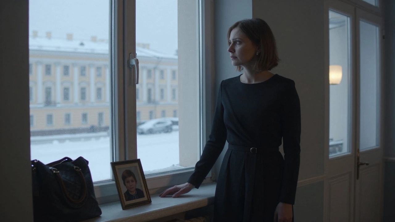 A woman by a snowy window in St. Petersburg, holding a photo, expressing quiet strength and emotional burden.
